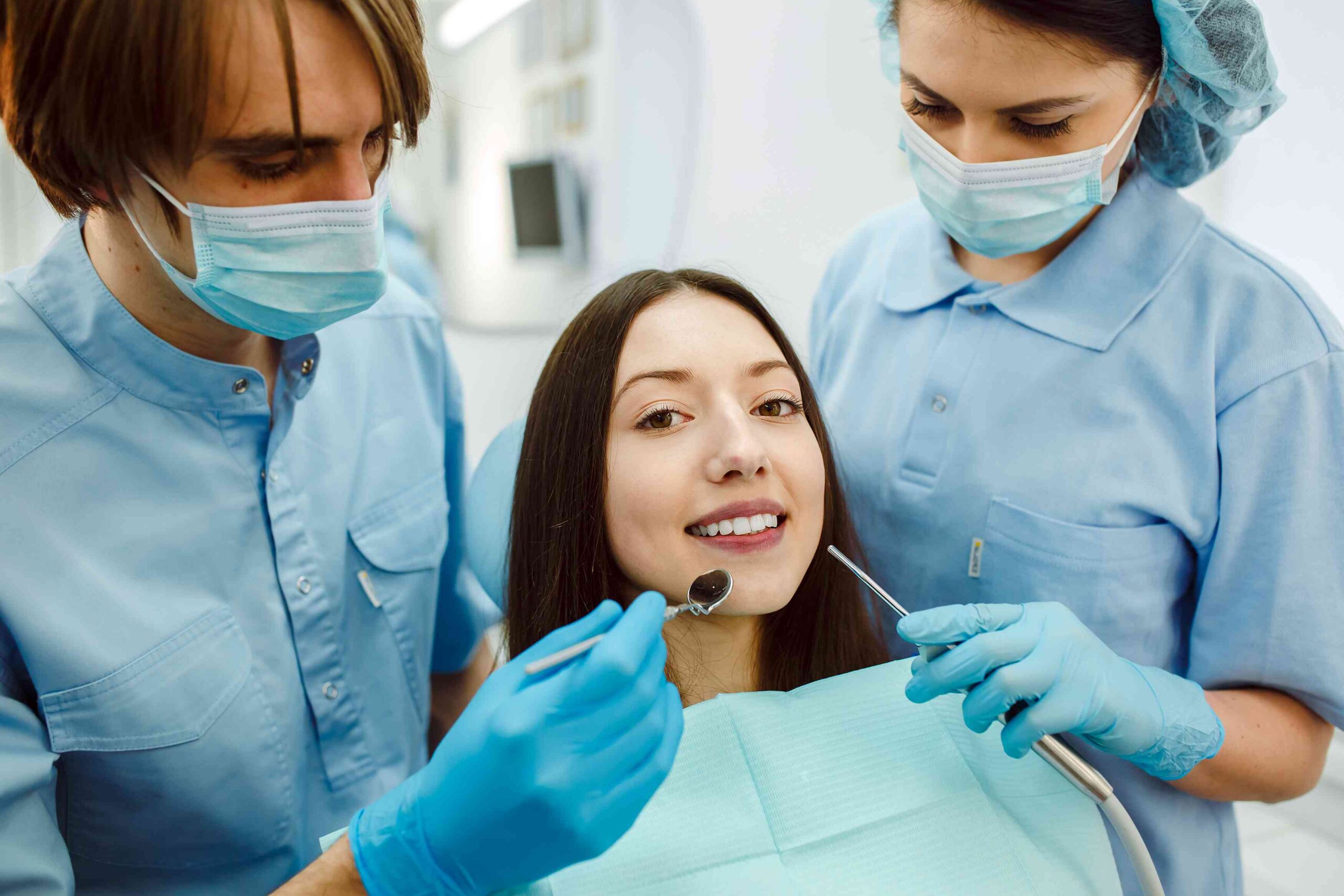 Patient smiling during dental exam.
